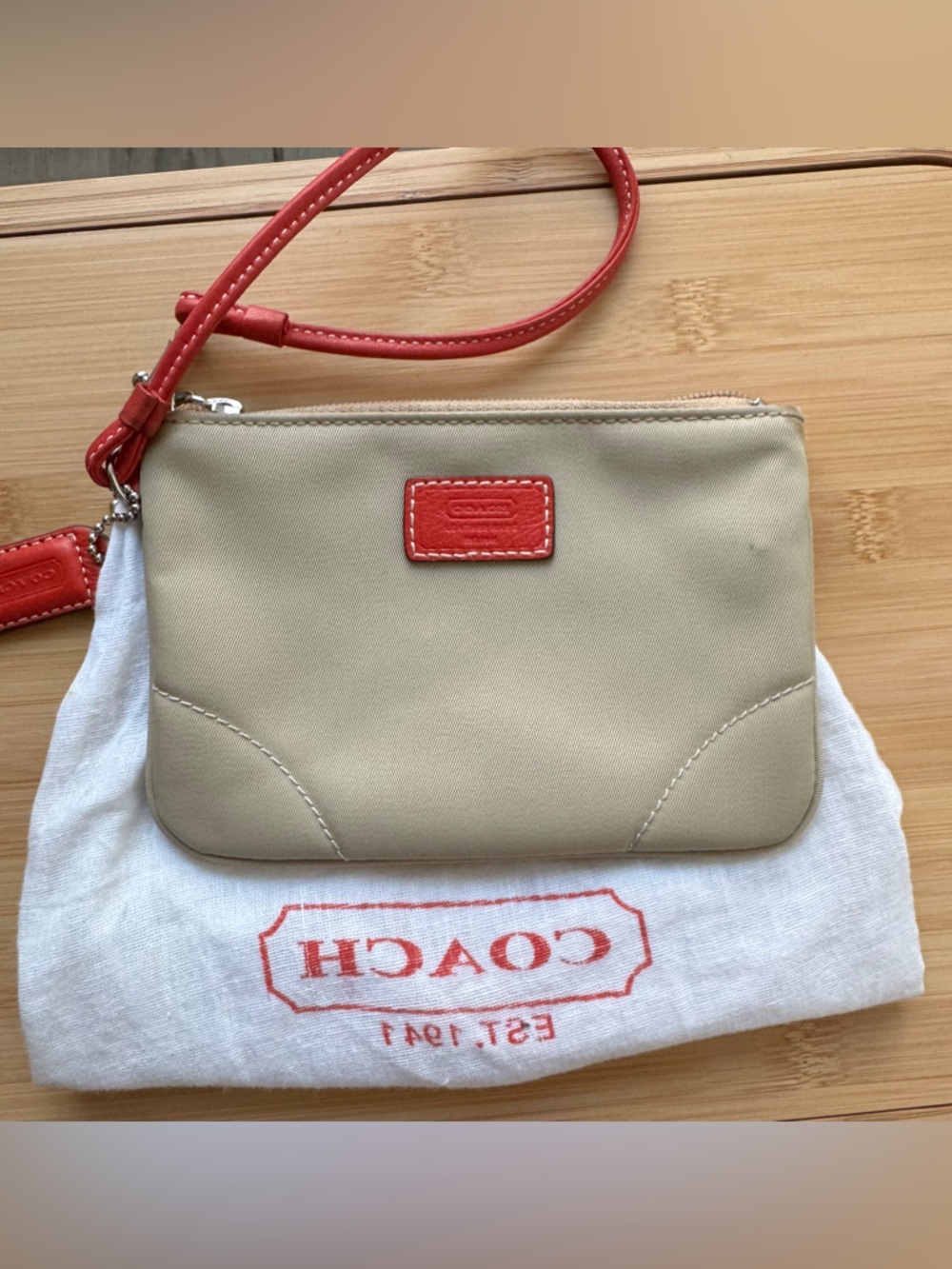 Coach Neutral Wristlet with Coral Accents